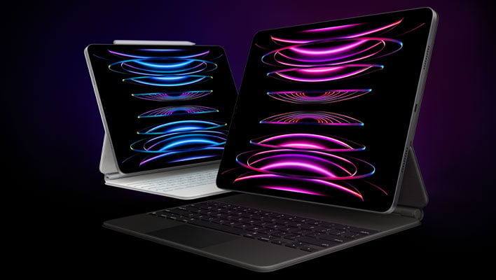 Two angled iPad Pro tablets with keyboard covers on a blue and black background.
