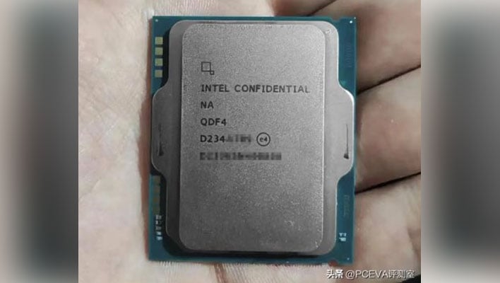 Hand holding an Intel CPU marked as confidential.