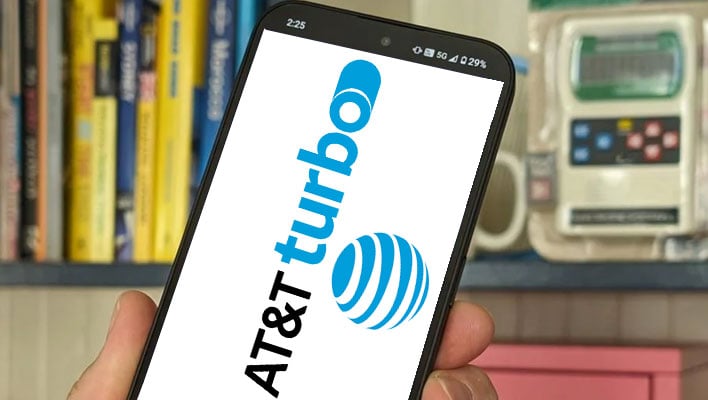 Holding a smartphone with "AT&T Turbo" and AT&T's logo on the display.