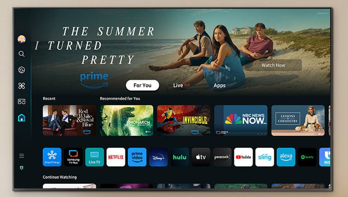 Samsung S90D OLED TV on a light orange background.