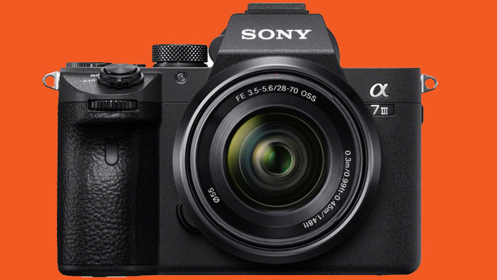 Sony Alpha 7 III mirrorless camera on an orange background.
