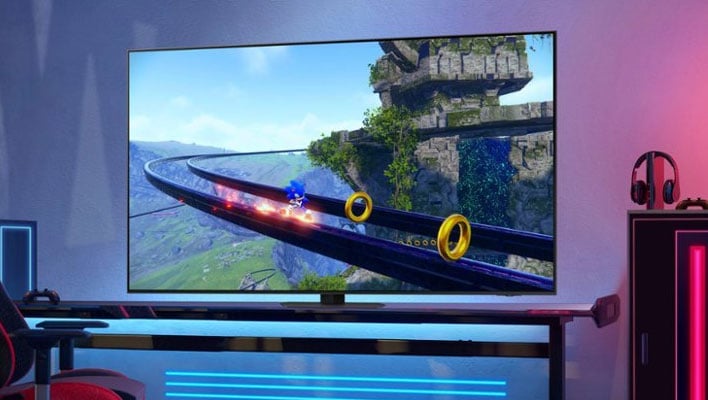 Samsung QN90C TV on a desk.