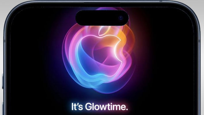 Top of an iPhone 15 Pro Max with Apple's Glowtime logo on the display.