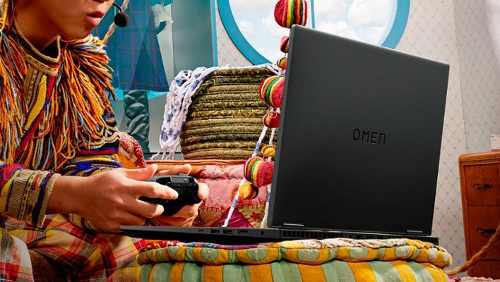 Gamer playing on an HP Omen laptop.