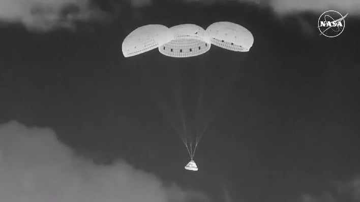 nasa boeing starliner parachuting to earth