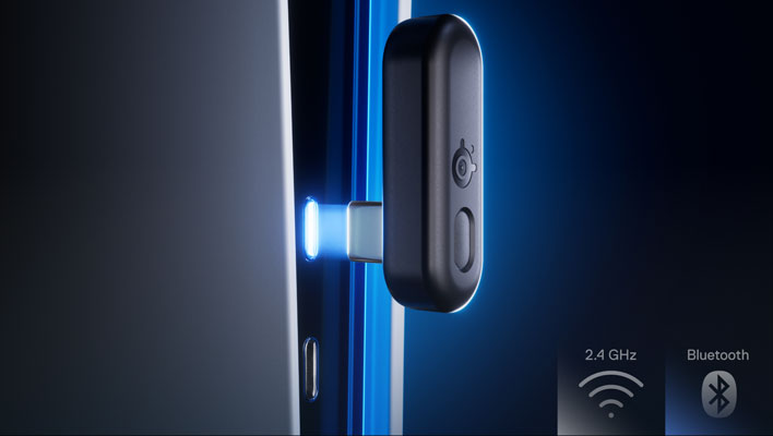 Wireless dongle for the SteelSeries Arctis GameBuds, being plugged into a PS5.