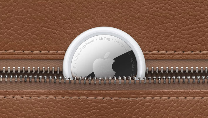 Apple AirTag tracker that's partially shoved in a zippered pouch.