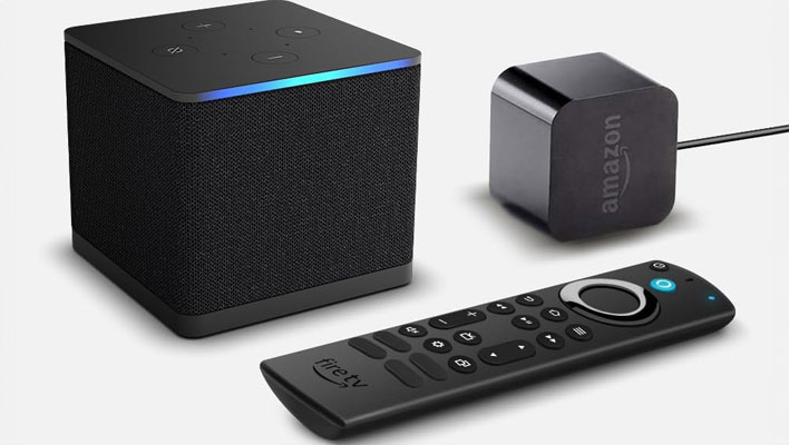 Amazon Fire TV Cube with remote and power adapter.