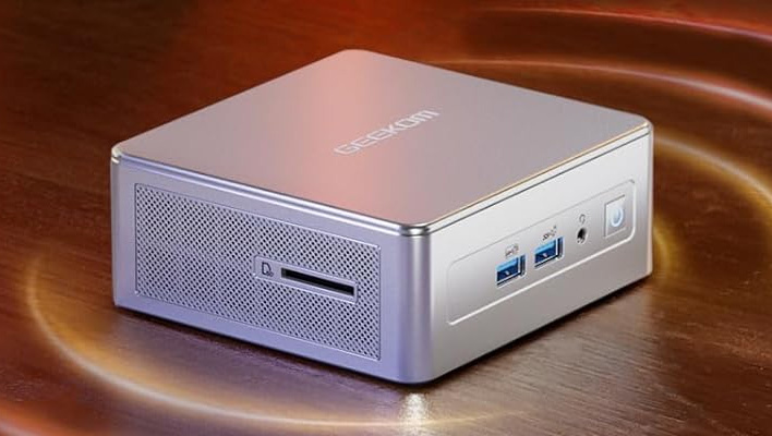 Angled look at Geekom's AE8 AI on a table.