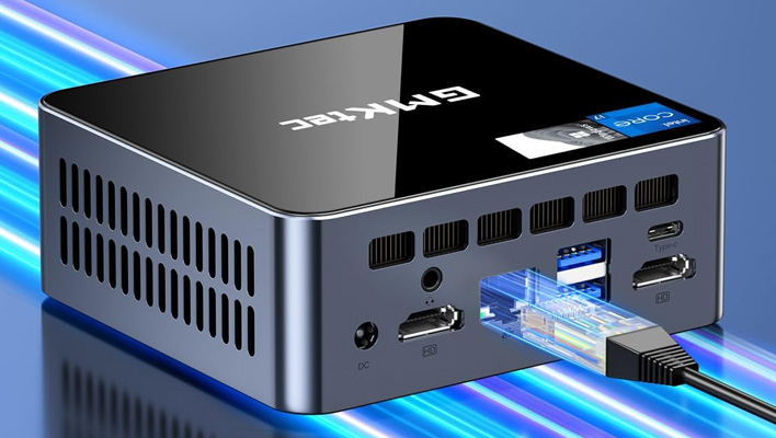 GMKteck mini PC on a lit-up blue background.
