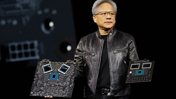 NVIDIA CEO Jensen Huang showcasing B200 Blackwell Superchips.