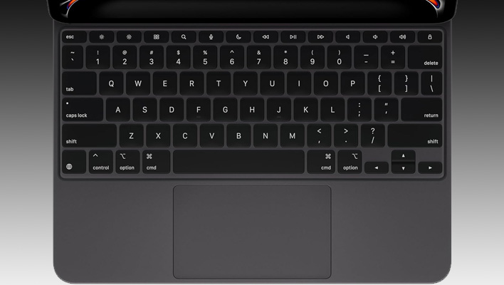 Apple iPad Magic Keyboard Case on a black and gray gradient background.