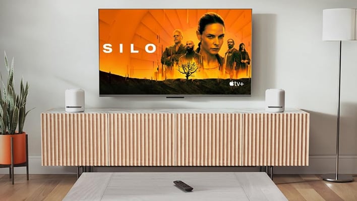 TV on a wall running Apple TV+ and an Alexa remote on a table.