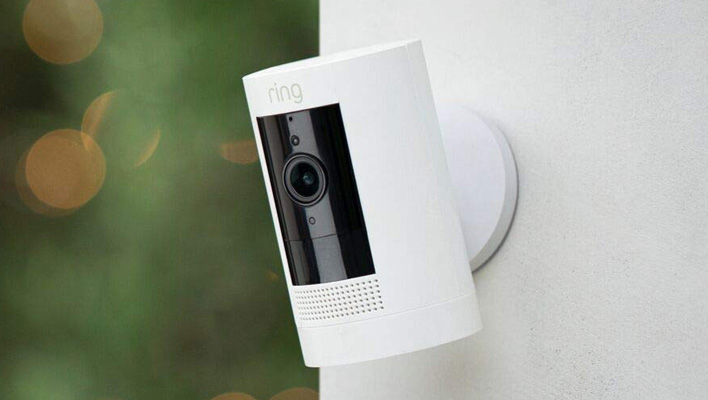 Ring Stick Up Cam mounted on the side of a house.