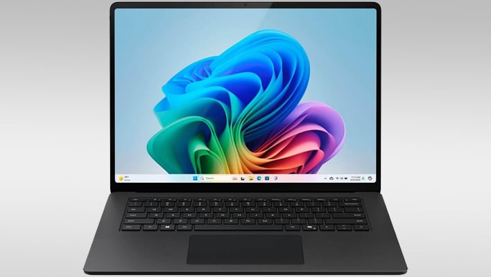 Front render of a black Microsoft Surface Laptop on a gray gradient background.