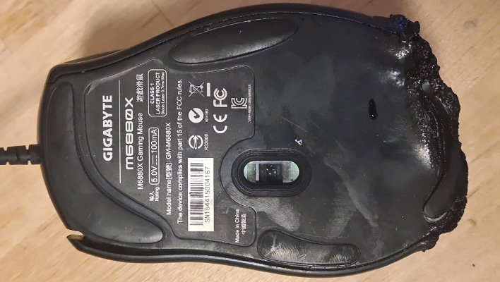 Underside of a burned Gigabyte GM-M6880X gaming mouse.
