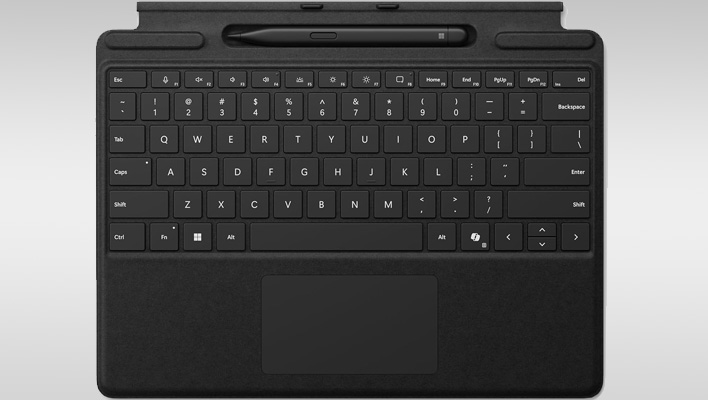 Black Surface Pro keyboard and Slim Pen 2 combo on a gray gradient background.