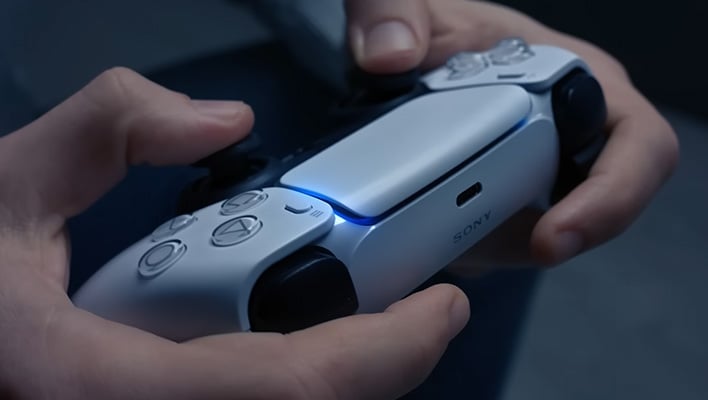 Gamer hold a Sony DualSense controller.