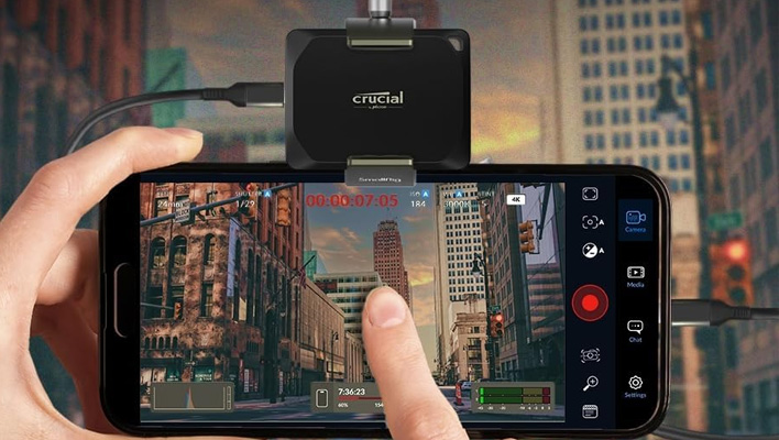 Crucial X10 Pro attached to a smartphone.