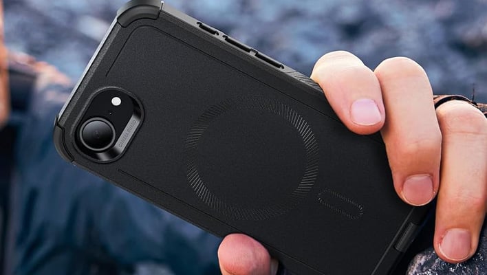 Man holding an iPhone 16e in an ESR case.
