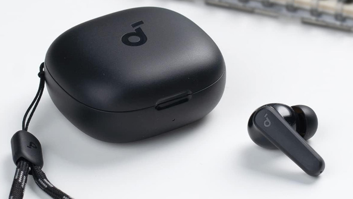 Soundcore by Anker P20i earbud next to its charging case.