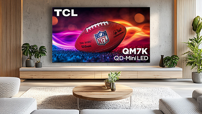 TCL QM7K TV on a wall in a living room.