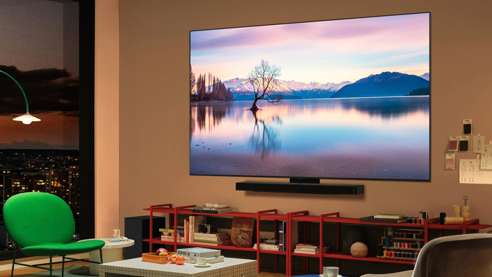Angled render of LG's C5 OLED TV on a wall in a living room.