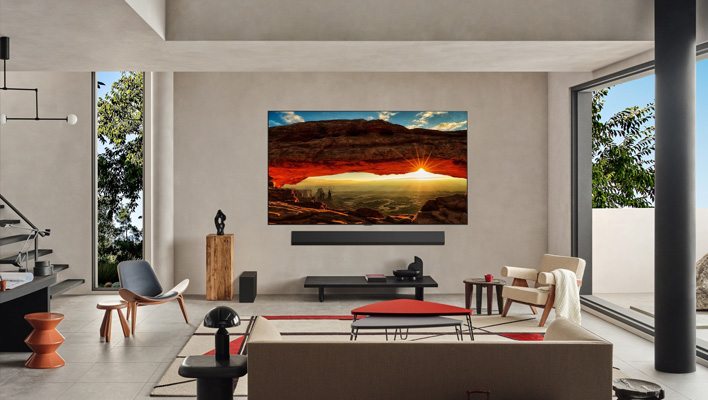 LG's G4 OLED TV on a wall in a living room.