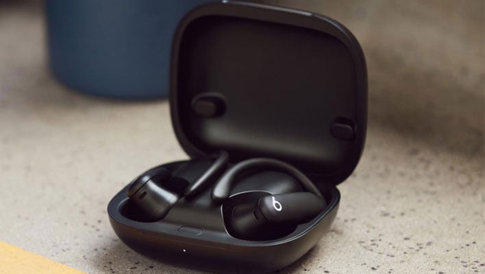 Beats Powerbeats Pro 2 earbuds in a charging case.