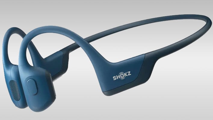 Shokz OpenRun Pro Premium earbuds on a gray gradient background.
