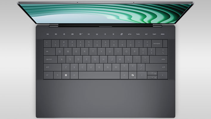 Top-down view of the keyboard on the Dell 14 Premium, on a gray gradient background.