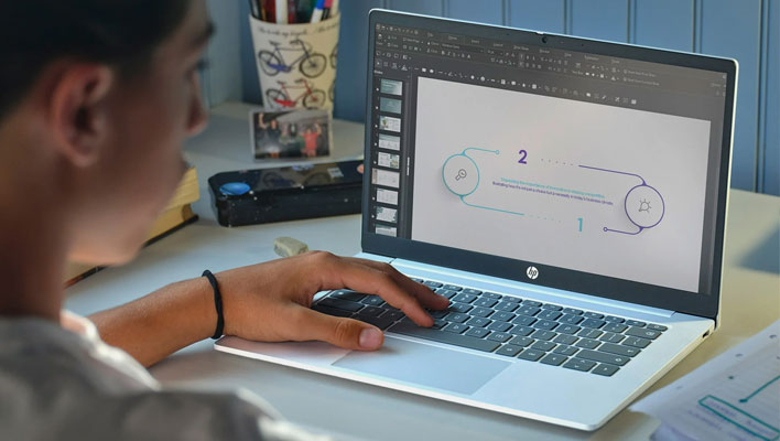 Person using an HP Chromebook at a desk.