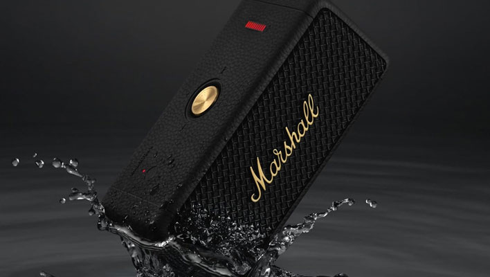 Marshall Emberton II speaker being dipped into a puddle.