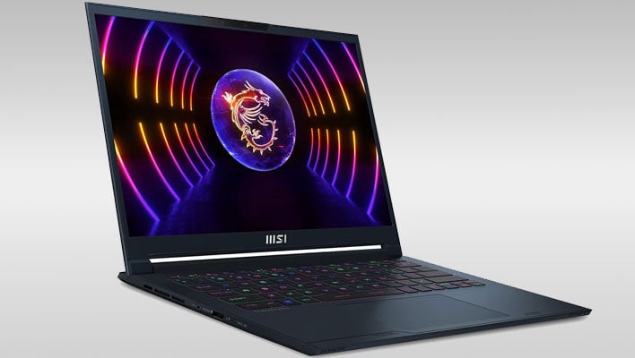 MSI Stealth 14 laptop sitting angled on a gray gradient background.