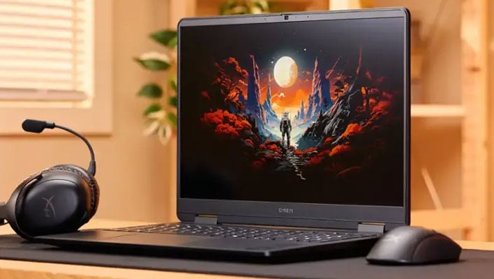 HP Omen laptop on a next in between a mouse and headset.
