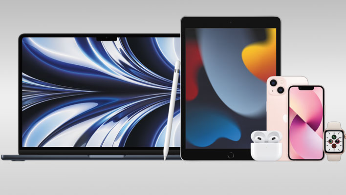 Apple devices on a gray gradient background.