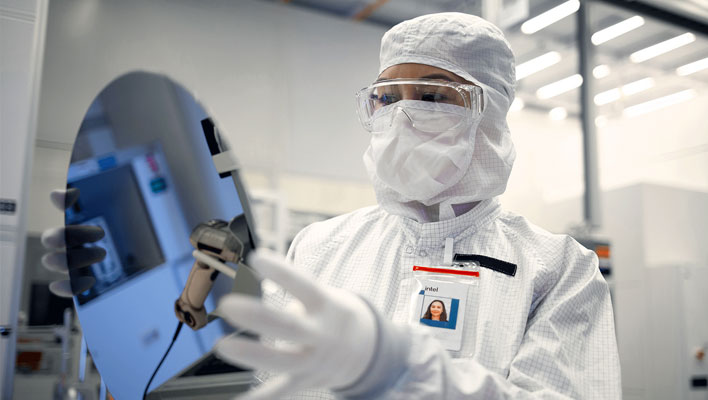 Intel engineer holding a semiconductor wafer.