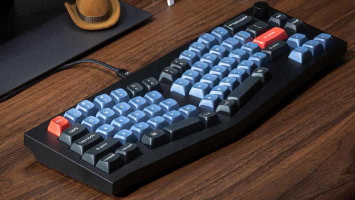 Keychron K8 keyboard on a wooden desk.