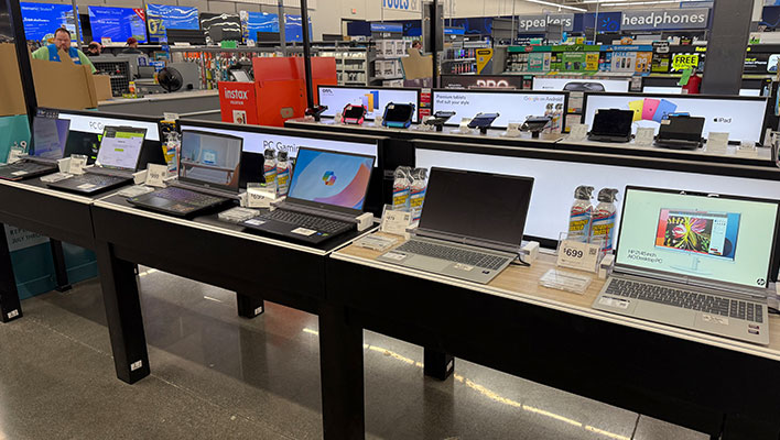 A row of laptops in Walmart.