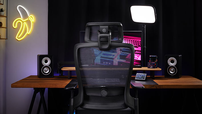 Rear view of Corsair's Elgato Embrace chair in front of a desk.