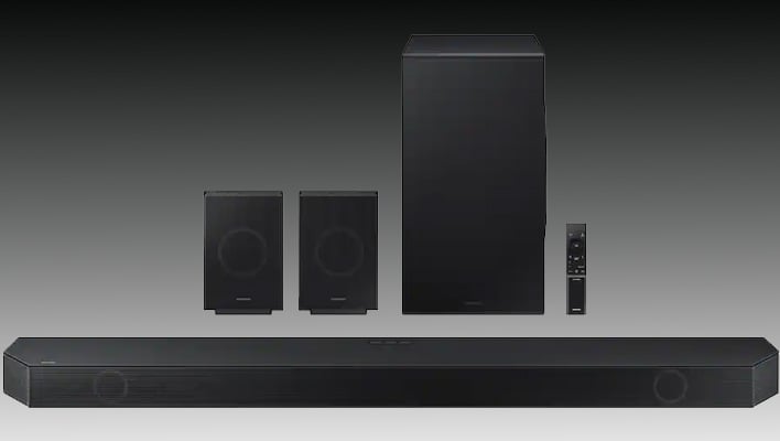 Render of Samsung's HW-Q990D soundbar system on a black and gray gradient background.