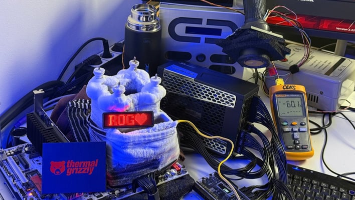An overclocking station with an LN2 pot and an LED display that reads "ROG" with a heart.