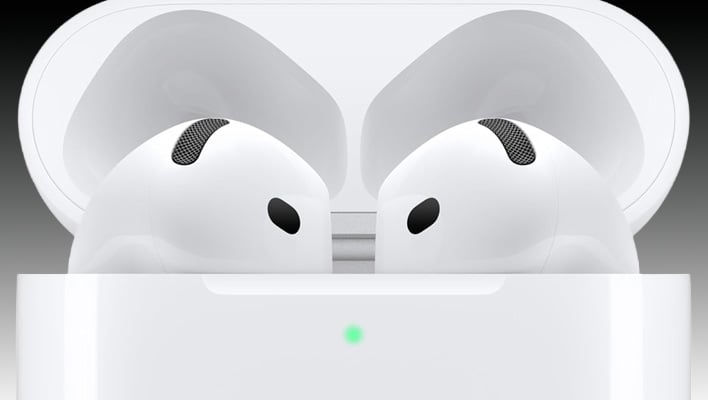 Closeup of AirPods 4 in a charging case on a black and gray gradient background.