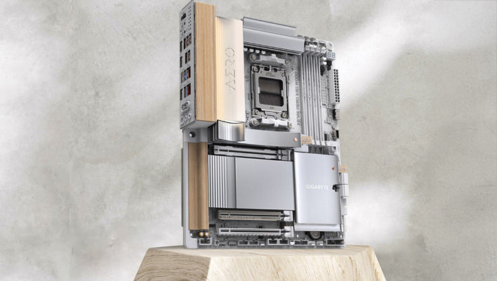 Gigabyte X870E Aero X3D Wood motherboard sitting angled on a wooden block.