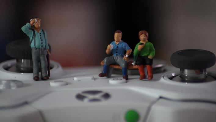 Figurines on an Xbox controller.