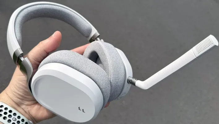 Holding a Fractal Design Scape headset.