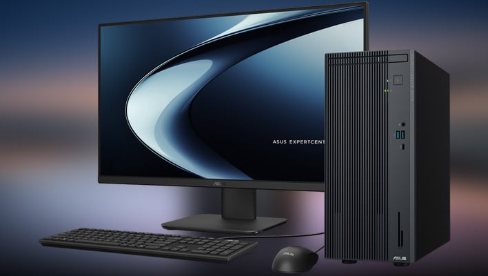 ASUS ExpertCenter P700 Mini Tower with keyboard, mouse, and monitor on a blurred background.
