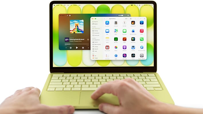 Using an Apple MacBook Neo in yellow.