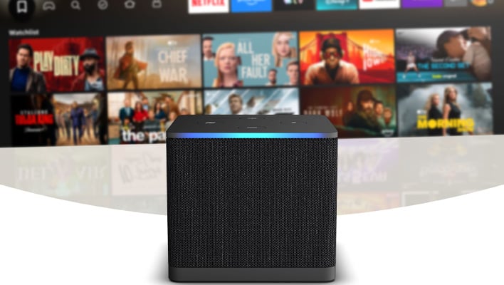 Amazon Fire TV Cube in front of a smart TV platform.