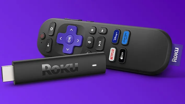 Roku streaming stick with remote on a purple background.